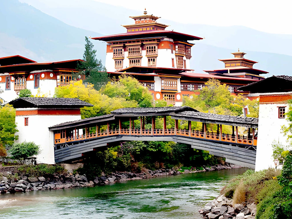 Punakha Dzong in Bhutan with traditional bridge and riverside setting under clear sky