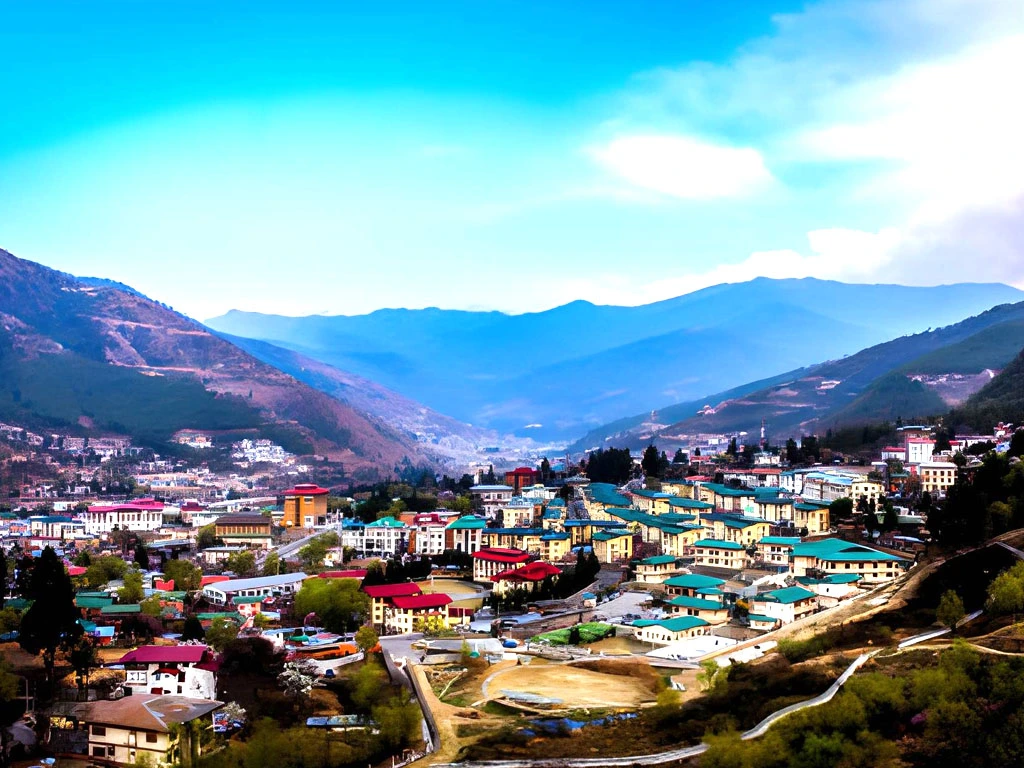 Panoramic view of Thimphu city in Bhutan with traditional buildings, mountain valley, and clear blue sky