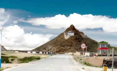 Chiu Monastery overlooking Lake Manasarovar in Tibet, a sacred hilltop monastery with panoramic views of the holy lake and surrounding Himalayan landscape.