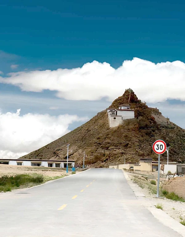 Chiu Monastery overlooking Lake Manasarovar in Tibet, a sacred hilltop monastery with panoramic views of the holy lake and surrounding Himalayan landscape.