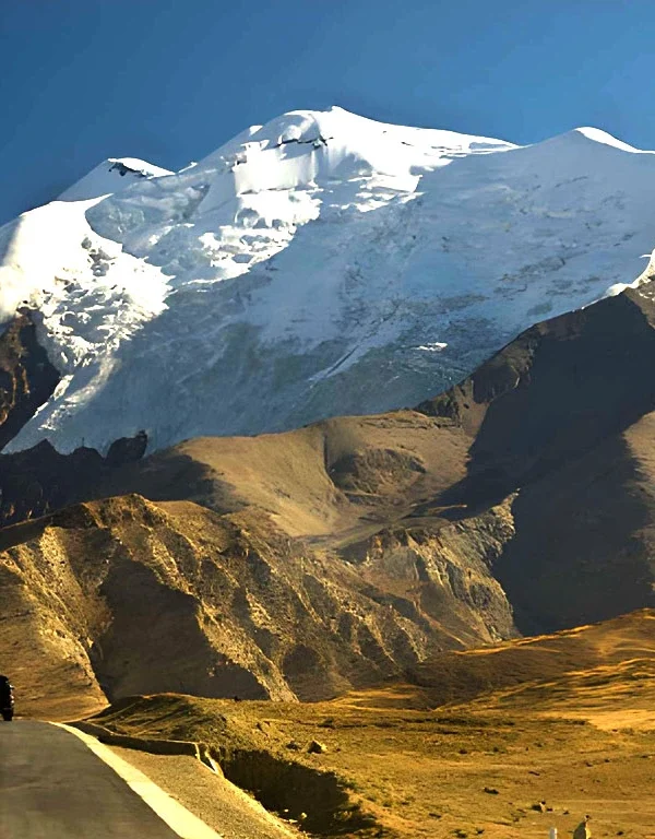 Kharola Glacier in Tibet, a dramatic high-altitude glacier descending from Himalayan peaks near Karola Pass along the Friendship Highway.