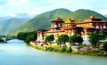 Punakha Dzong monastery in Bhutan located between Pho Chhu and Mo Chhu rivers with Himalayan hills
