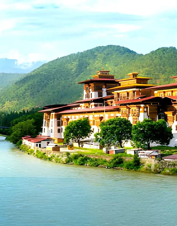 Punakha Dzong monastery in Bhutan located between Pho Chhu and Mo Chhu rivers with Himalayan hills