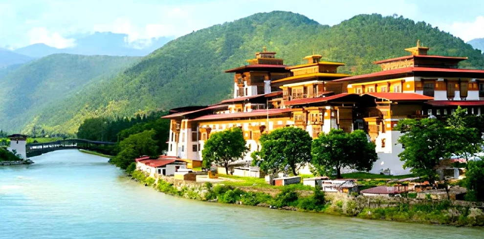 Punakha Dzong monastery in Bhutan located between Pho Chhu and Mo Chhu rivers with Himalayan hills
