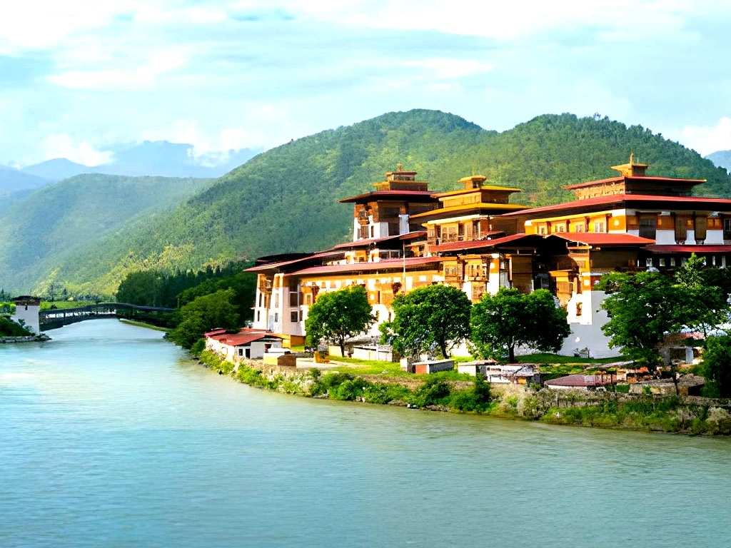 Punakha Dzong monastery in Bhutan located between Pho Chhu and Mo Chhu rivers with Himalayan hills