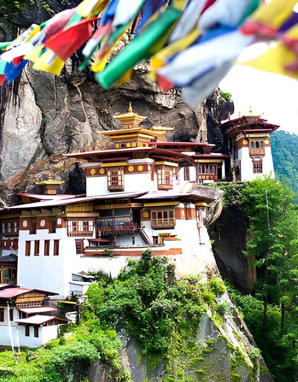 Taktsang Palphug Tiger’s Nest Monastery in Paro Bhutan built on a cliff with prayer flags