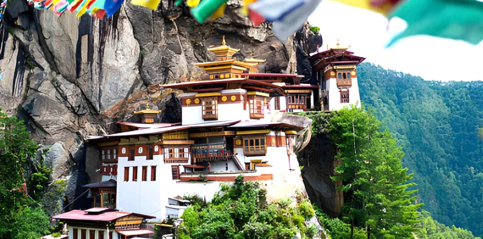 Taktsang Palphug Tiger’s Nest Monastery in Paro Bhutan built on a cliff with prayer flags