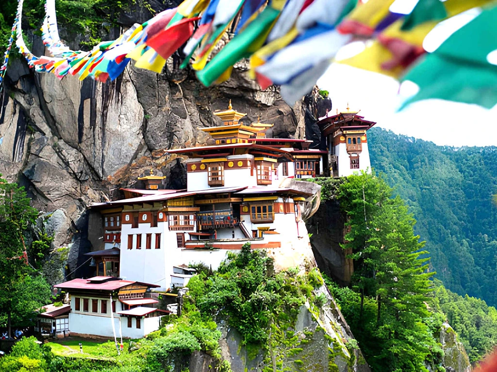 Taktsang Palphug Tiger’s Nest Monastery in Paro Bhutan built on a cliff with prayer flags