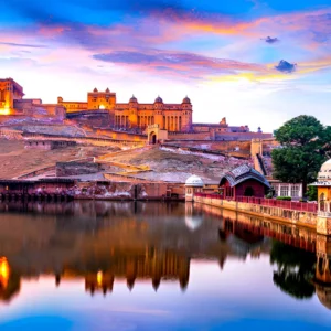 Amber Fort in Jaipur reflected in Maota Lake at sunset, Rajasthan, India